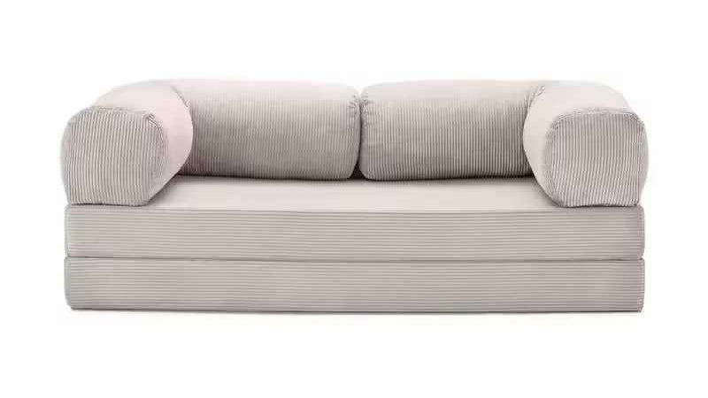 Gray sofa with ribbed texture on a white background