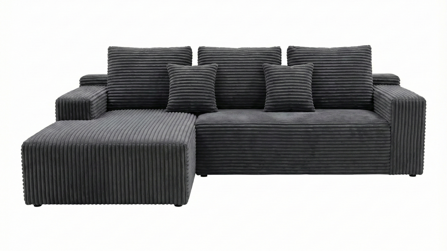 Gray sectional sofa with striped cushions on a white background