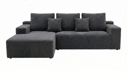 Gray sectional sofa with striped cushions on a white background